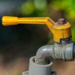 a close up of a yellow handlebar on a bike